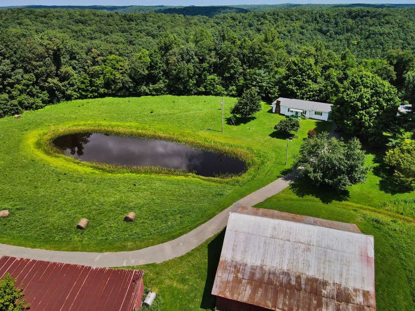 035 elevated view of the home and pond from above the barn