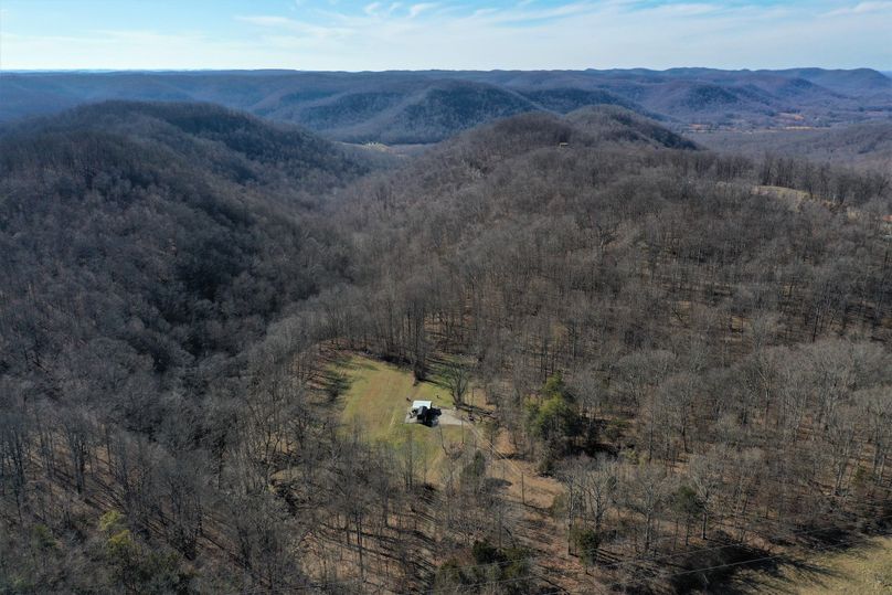 001 aerial drone shot from the east side of the property looking west down the valley