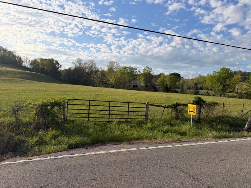 009 Convenient highway frontage with a secure gate leading into gently rolling pasture, ideal for a homesite or mini-farm-2