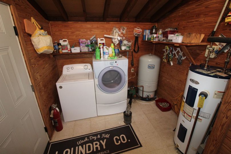 092 the utility room with water well_pump, washer_dryer and water heater