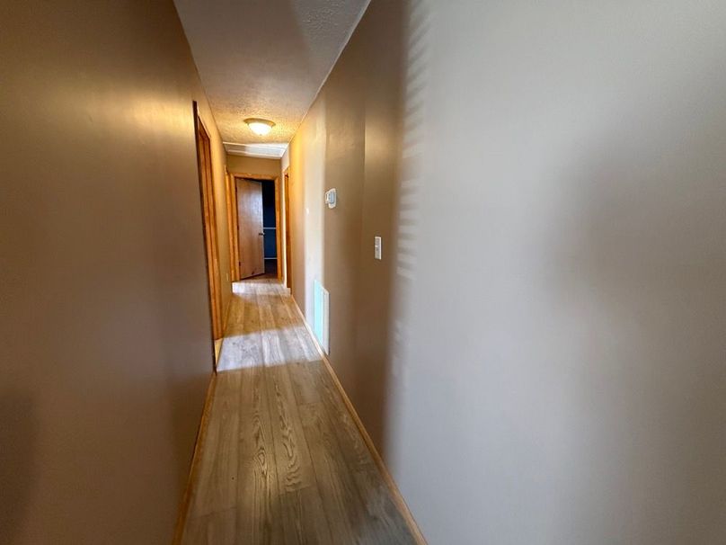 020 the hallway leading to the 3 bedrooms and 2 baths