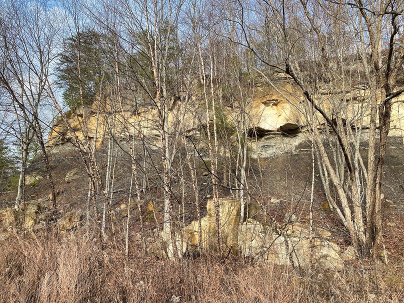 009 glimpse of the rock face cliffs remaining from the old mining activities from many years ago