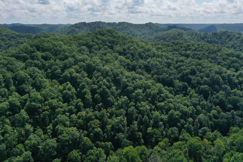 007 aerial drone shot from the northwest corner looking to the east along the ridgetop