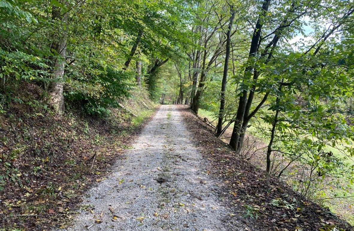 003 the county gravel road at the northeast west corner of the property near the entrance