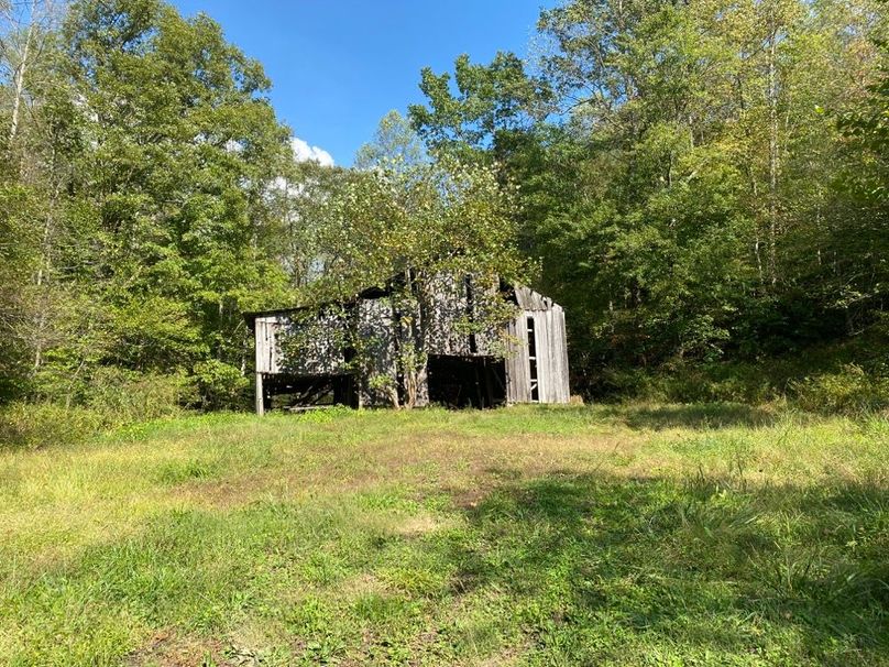 004 the barn that stands near the road at the northwest area of the property