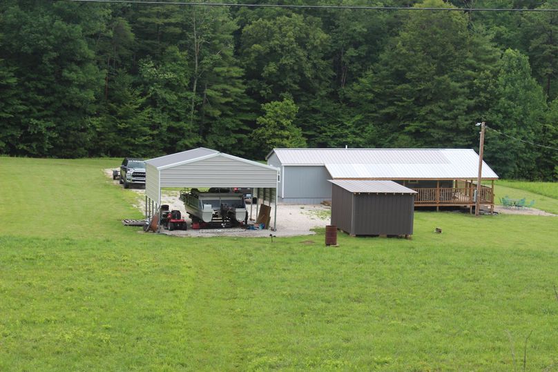 019 ground level view showing the cabin, shed and covered awning