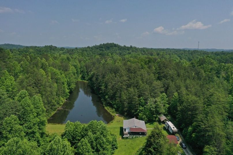 001 aerial drone shot of the home and pond