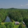 001 aerial drone shot of the home and pond