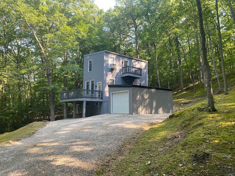 019 view of the modern salt box style home as approaching from the driveway copy