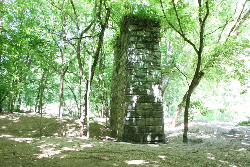 004 one of several towering stone bridge piers on the property near the river