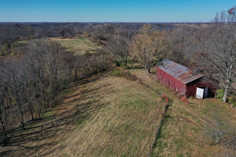 006 the old red barn sitting just back from the home 