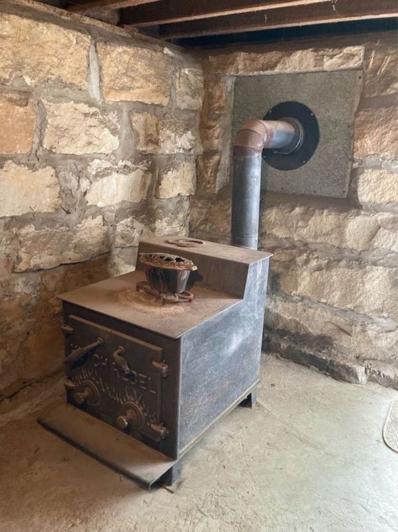 120 the wood furnace in the downstairs cellar provides a super efficient heat source throughout