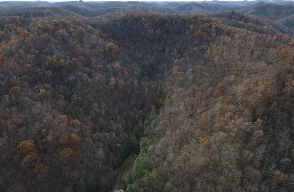 001 Commanding aerial perspective showing the northeast gateway, valley system, and overall lay of the land