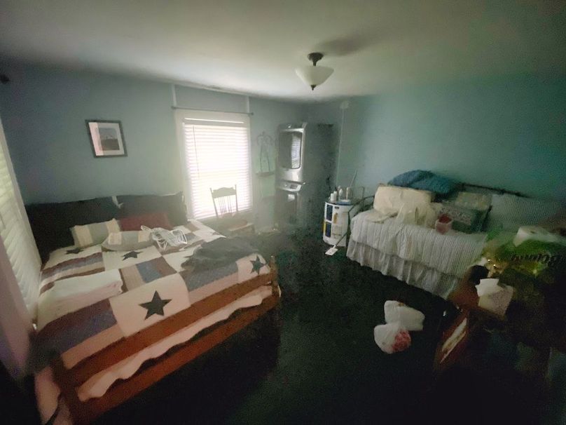 033 Bedroom #1 sitting in the front northeast corner of the home