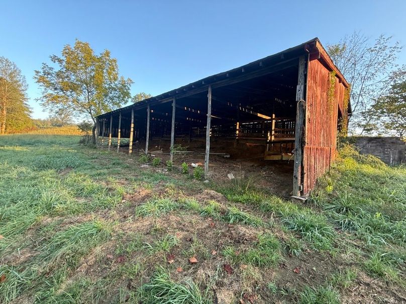 017 Classic red barn positioned along open pasture adds character and functionality.