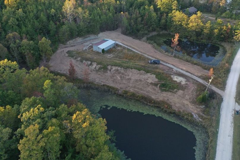 006 aerial drone view of the building and ponds