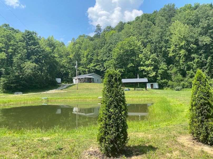 001 view of the pond, fire pit area and barndominium copy