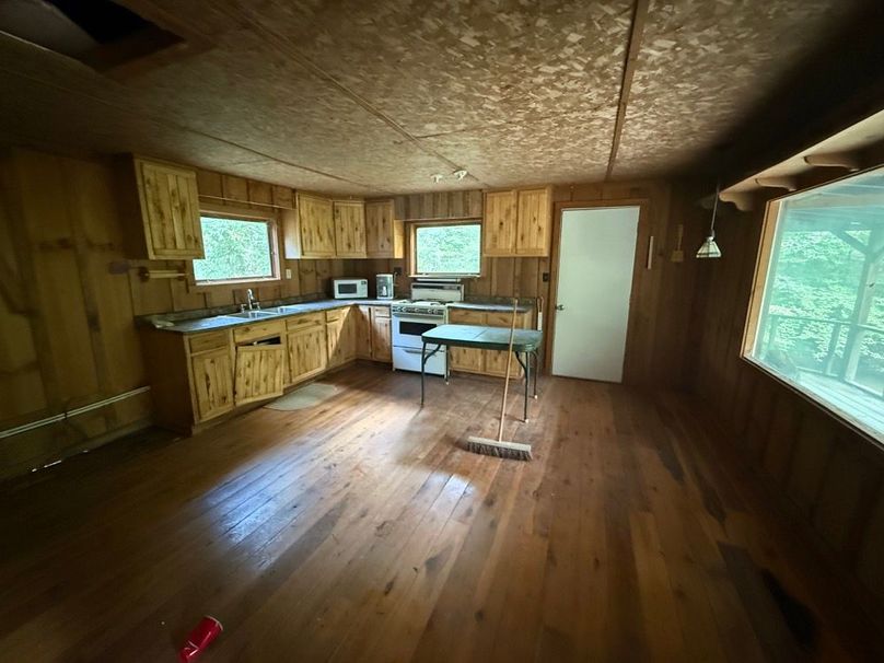 051 the inside of the cabin showing the kitchen area and the living room space