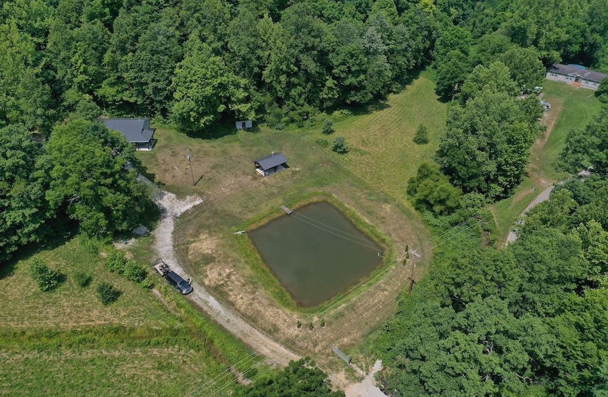 004 aerial drone shot looking down on the pond and barndo