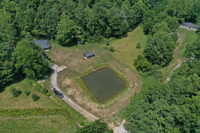 004 aerial drone shot looking down on the pond and barndo