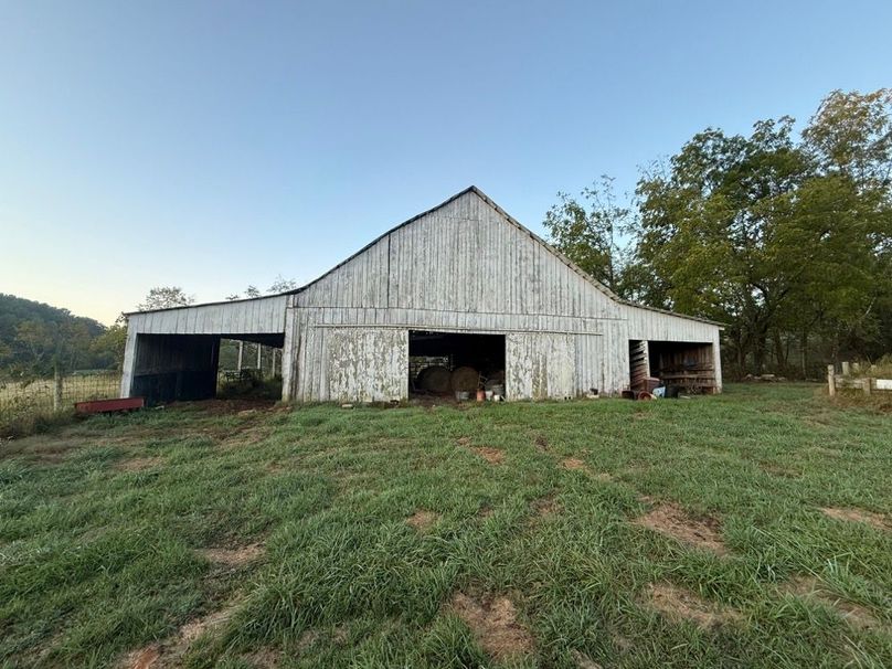 004 Spacious traditional barn offering excellent storage for equipment, hay, or livestock with easy access from the pasture.