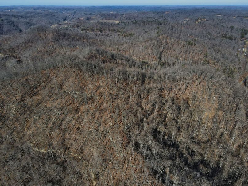 041 aerial view showing rock outcroppings at the west portion of the property
