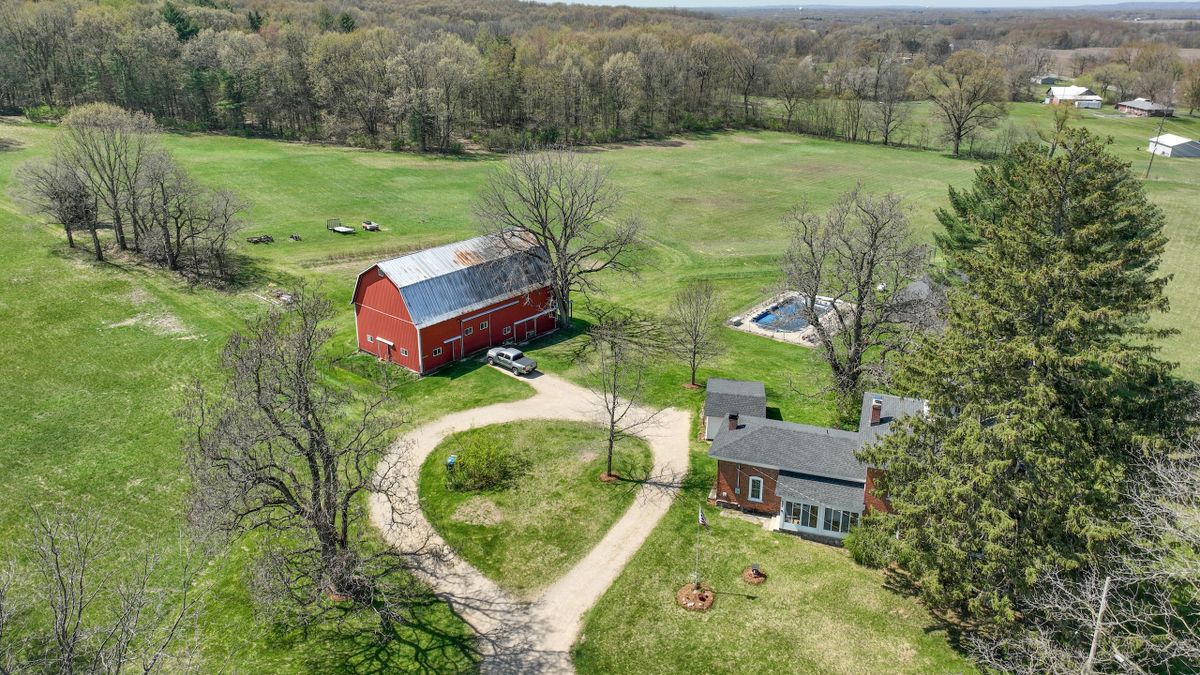 Iconic Southwest Michigan Home Nestled On Beautiful Rolling Timber And