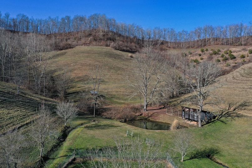 007 low elevation drone shot of the pond and chicken house