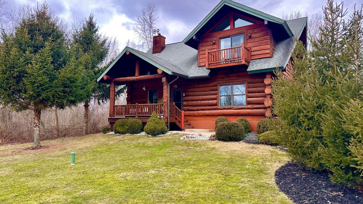 Outstanding Hand Scribed Log Home With Frontage On The Red Cedar River