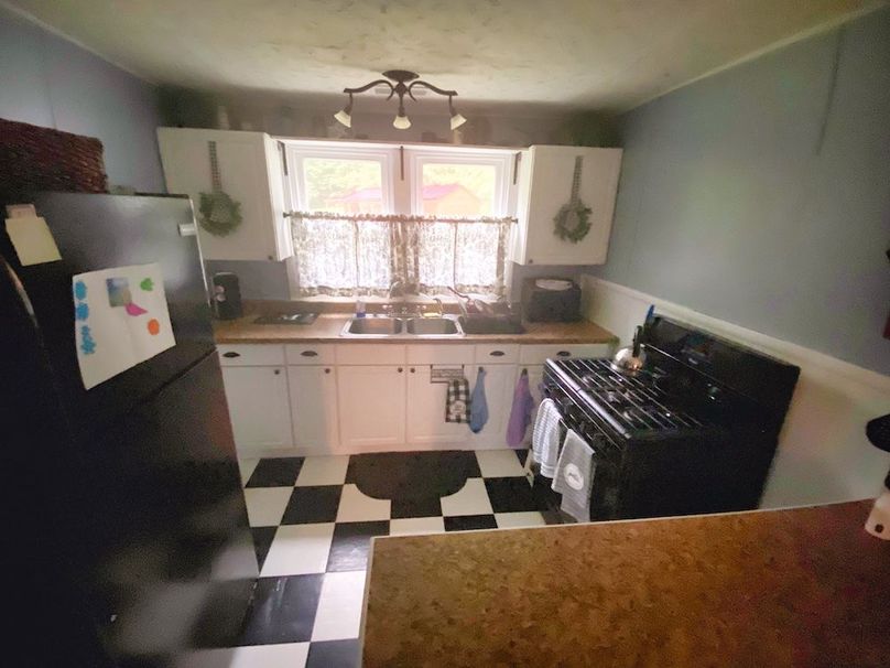 031 the kitchen area in the back southeast corner of the home