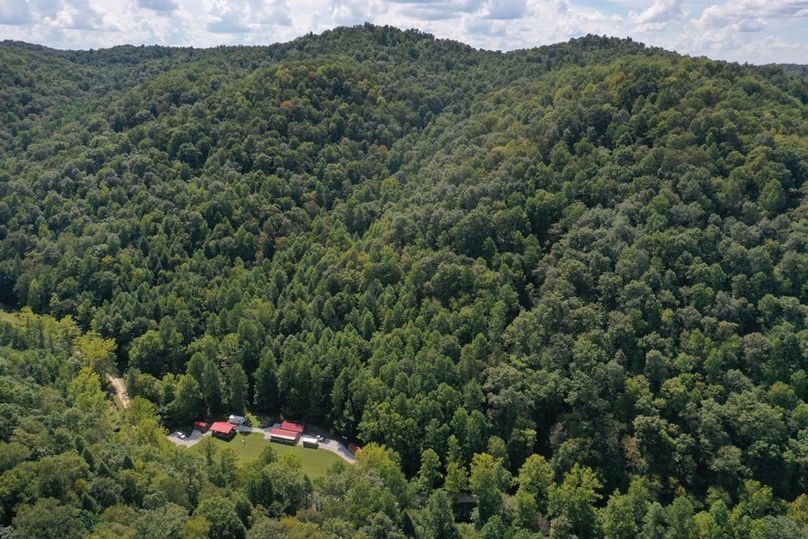 003 an aerial drone shot of the gathering location and the beautiful mountains in the backdrop