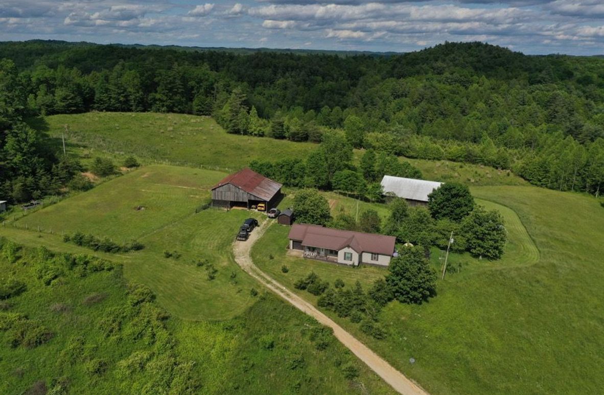 001 aerial drone shot of the home and structures from the west