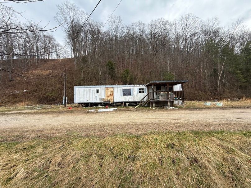 011 the old mobile home sitting just inside the entrance at the north boundary