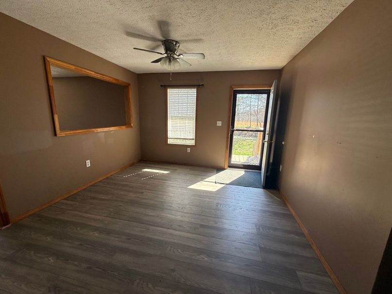 021 view of the front door and living space as you begin down the hallway
