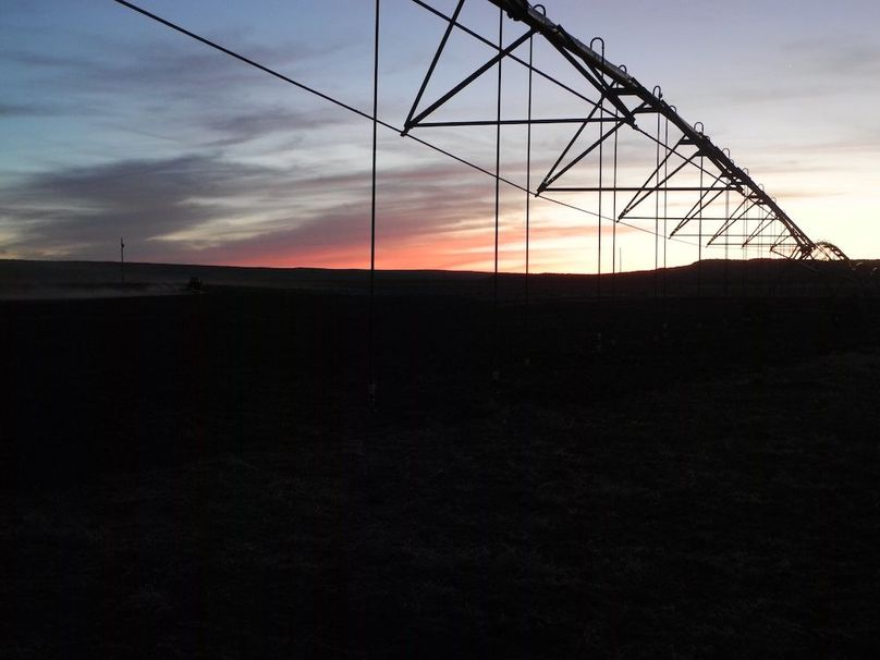 40.1_Pratt Hay field sprinkler sunset
