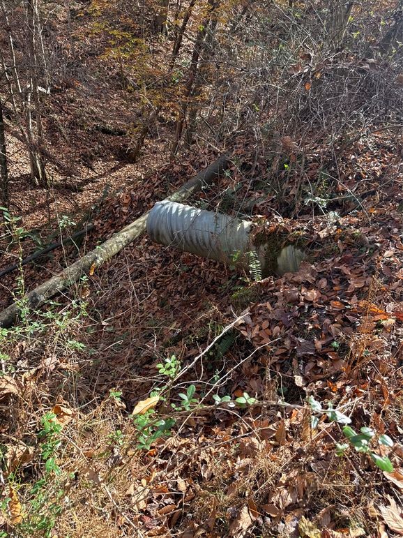 020 Exposed Pipe showing proper drainage for Gas Well Road Bed