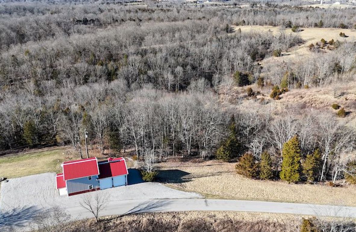 001 aerial drone shot from the east boundary and road overlooking the property