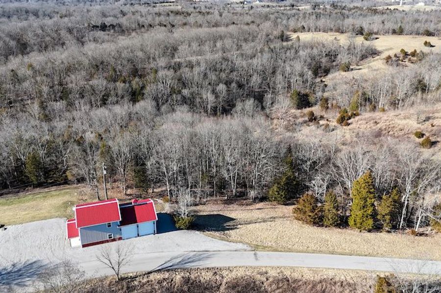 001 aerial drone shot from the east boundary and road overlooking the property