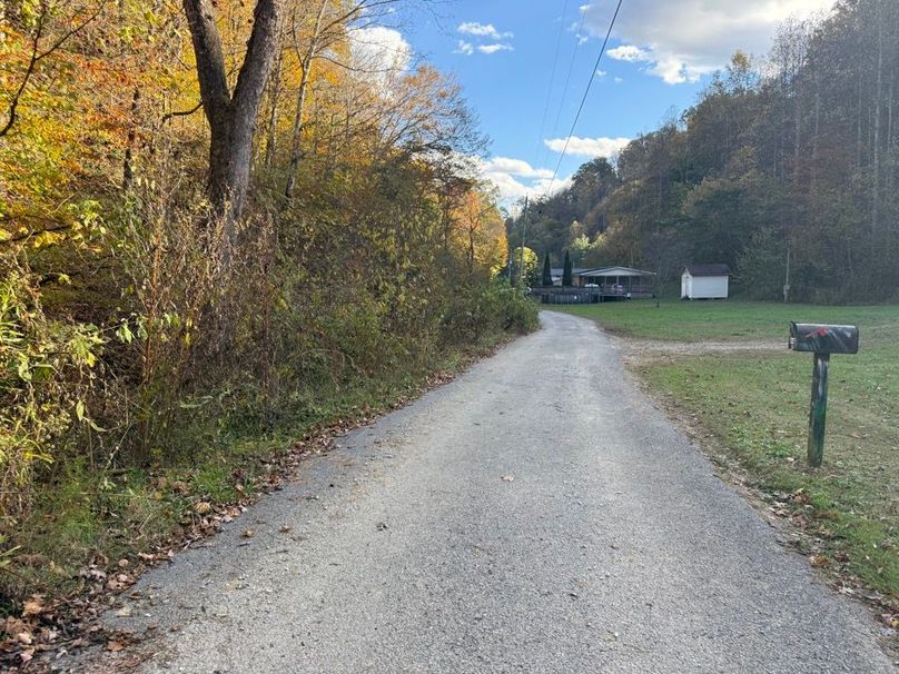 009 blacktop road leading into the entrance of the property