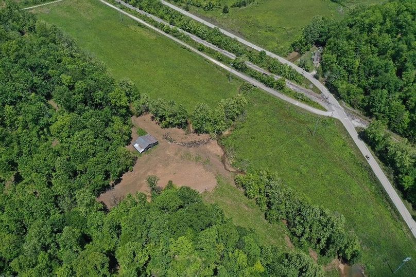 012 low elevation drone shot looking down on the home lot and barn
