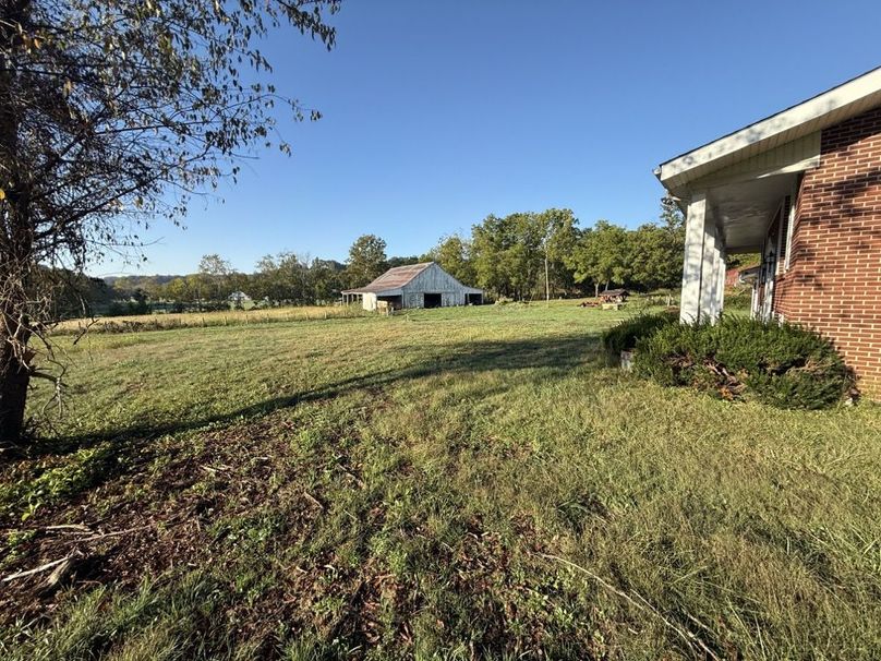 022 Expansive yard connects the home to nearby barns and pasture.