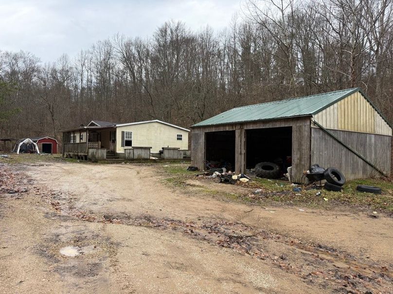 021 the doublewide mobile home that is at a hinge point of teardown or patch up