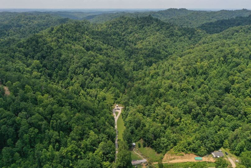 001 aerial drone shot from the road looking northwest into the property