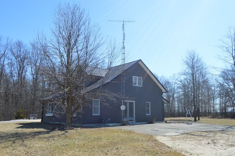 Side view of Primary home from pond