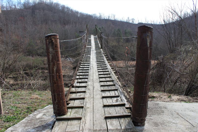 007 the approach to the swinging walk bridge leading onto the property
