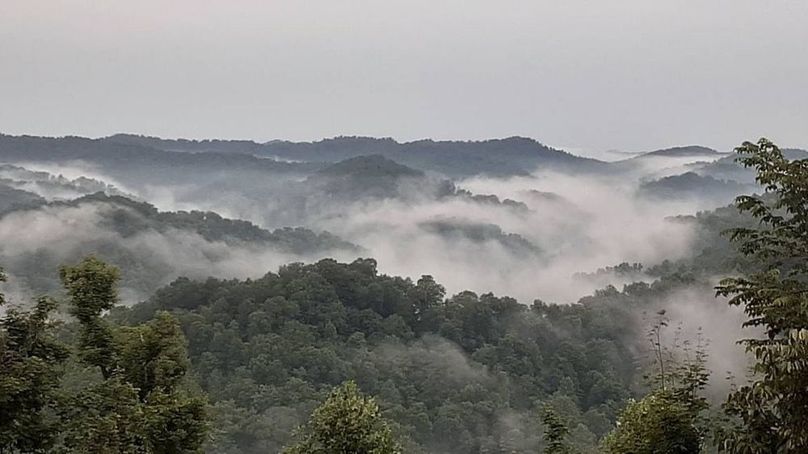 050 the view across the valley from the upper south ridge on a cool foggy morning