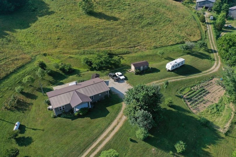 027 aerial drone shot looking at the home from the northwest boundary