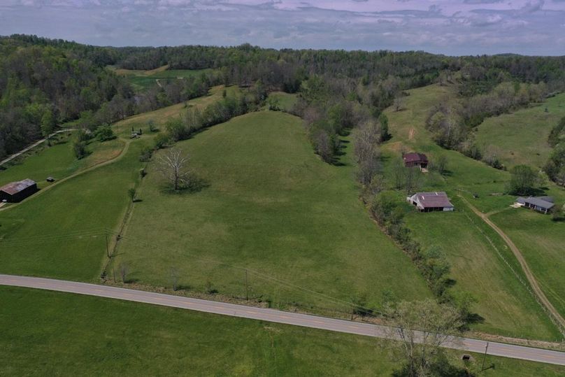 001 Stunning aerial perspective capturing the full character of the property. A gently rolling pasture, scenic surroundings, and excellent accessibility