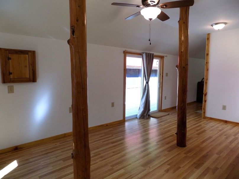 Interior of house showing view of sliding doow to deck