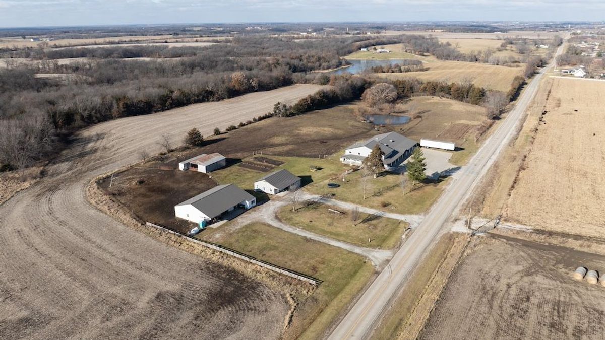 Clean Acreage On A Paved Road With A Home, Huge Steel Building, And ...